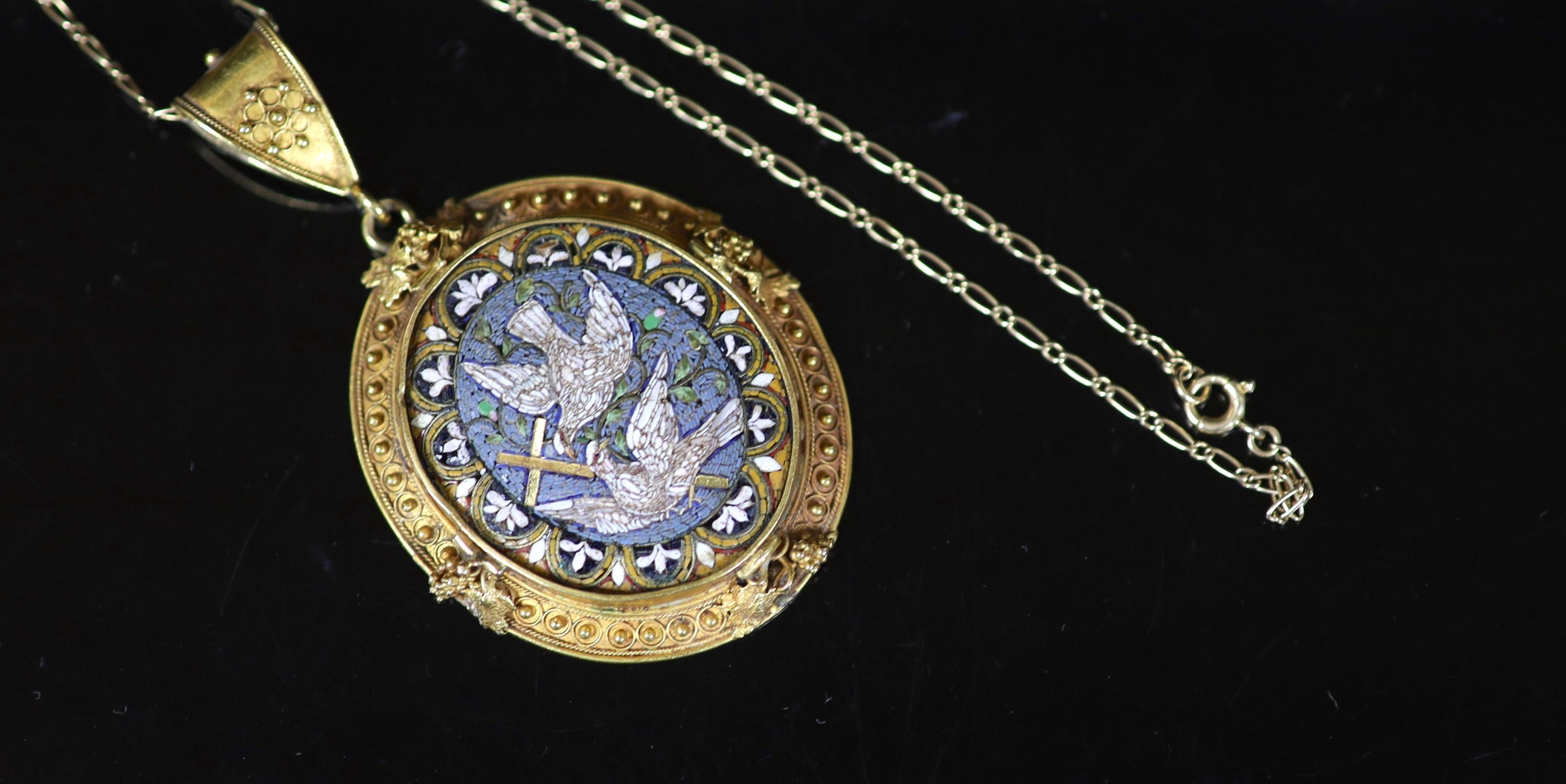 A 19th century gold and micro mosaic set oval pendant, decorated with Doves of Peace